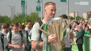 Celtic players parade Premiership trophy in front of fans