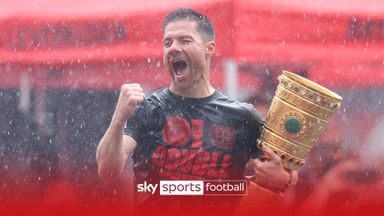 Leverkusen celebrate their unbeaten double in the rain!