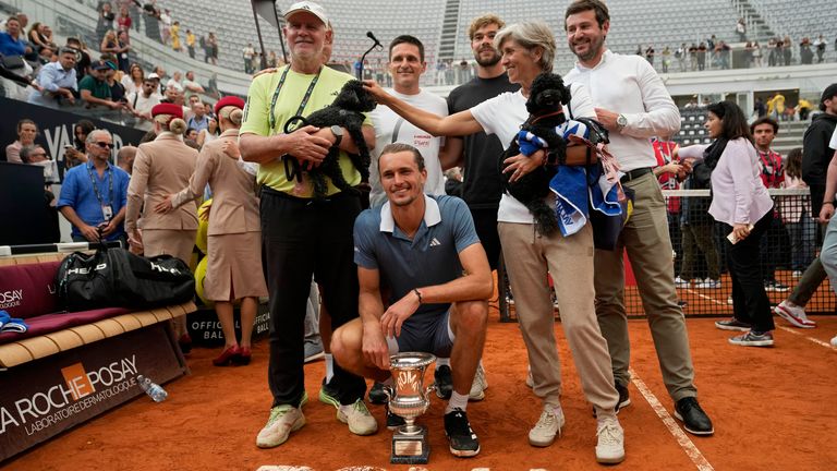 Alexander Zverev, of Germany, poses with his trophy and his parents, Alexander and Irina, after defeating Nicolas Jarry, of Chile, in the Italian Open tennis tournament final match at Rome's Foro Italico, Sunday, May 19, 2024. Zverev won 6-4/7-5. (AP Photo/Alessandra Tarantino)