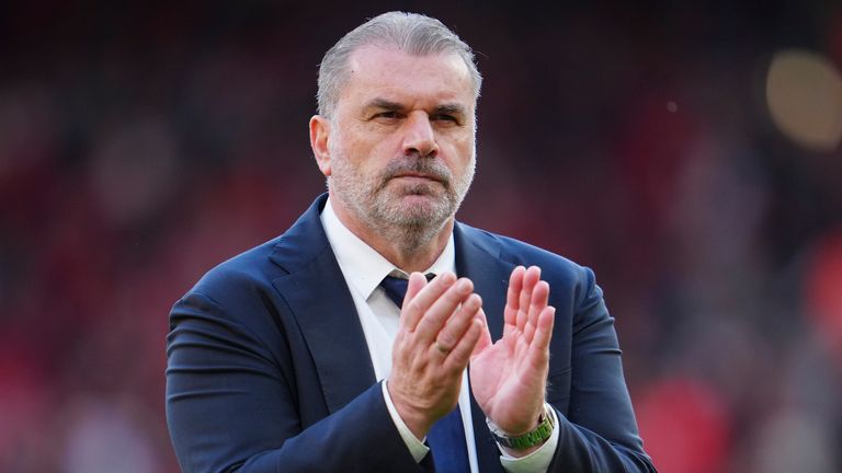 Ange Postecoglou applauds the away fans at Anfield