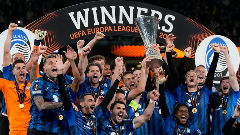 Berat Djimsiti, center, holds up Europa League trophy as he celebrates with his teammates at the end of the Europa League final between Atalanta and Bayer Leverkusen 