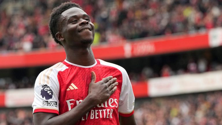 Arsenal's Bukayo Saka celebrates after scoring his side's opening goal