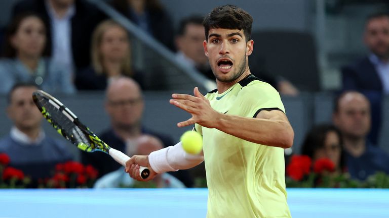 Carlos Alcaraz of Spain plays a forehand against Andrey Rublev of Russia during their Men’s Singles quarter-final match on Day Nine of the Muta Madrid Open at La Caja Magica on May 01, 2024 in Madrid, Spain. (Photo by Clive Brunskill/Getty Images)