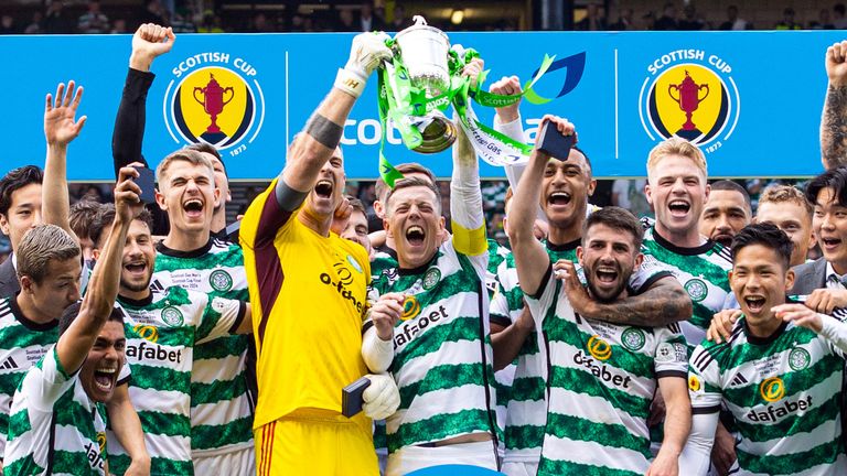 Celtic's Callum McGregor and Joe Hart lift the Scottish Cup trophy