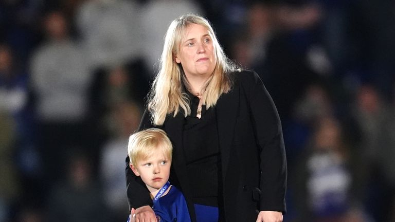 Emma Hayes with her son on the Kingsmeadow pitch