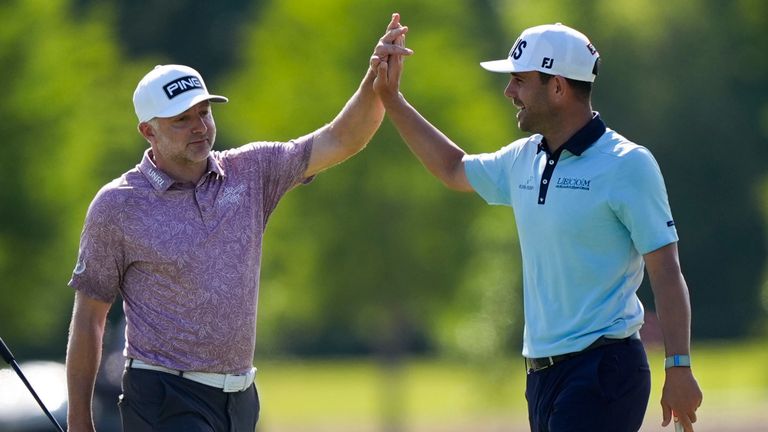 David Skinns, of England, left, and Callum Tarren, of England, celebrate on the 13th green during the first round of the PGA Zurich Classic golf tournament at TPC Louisiana in Avondale, La., Thursday, April 25, 2024. (AP Photo/Gerald Herbert)