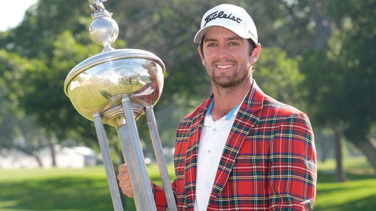 Davis Riley poses with the winner's trophy at the Charles Schwab Challenge golf tournament at Colonial Country Club in Fort Worth, Texas, Sunday, May 26, 2024. (AP Photo/LM Otero)