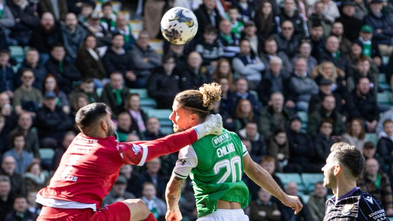 EDINBURGH, SCOTLAND - APRIL 06: Dimitar Mitov of St Johnstone collides with Emiliano Marcondes of Hibernian in the penalty area during a Premiership match between Hibernian and St Johnstone at Easter Road on April 06, 2024 in Edinburgh, Scotland.  (Photo by Alan Harvey / SNS Group)