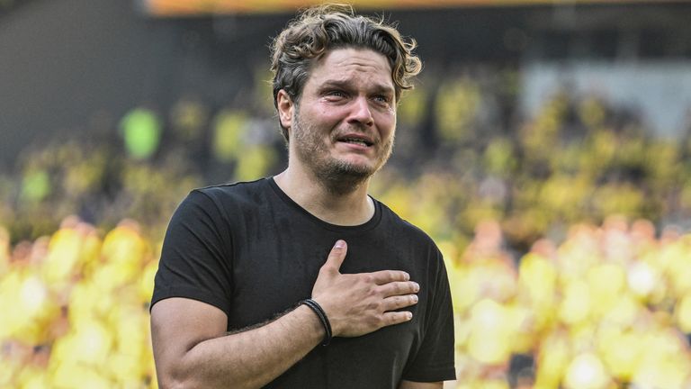 Borussia Dortmund coach Edin Terzic cries after the German Bundesliga soccer match between Borussia Dortmund and FSV Mainz 05 in Dortmund, Germany, Saturday, May 27, 2023.