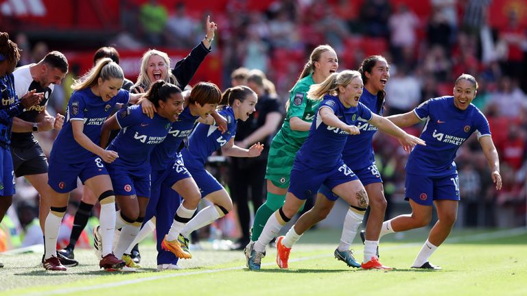 Emma Hayes and her players celebrate after winning the Barclays WSL title with a 6-0 win over Man Utd