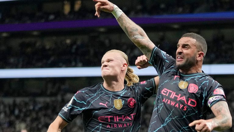 Manchester City's Erling Haaland and Manchester City's Kyle Walker celebrate scoring their side's second goal during the English Premier League soccer match between Tottenham Hotspur and Manchester City at Tottenham Hotspur Stadium in London, Tuesday, May 14, 2024.(AP Photo/Kin Cheung)