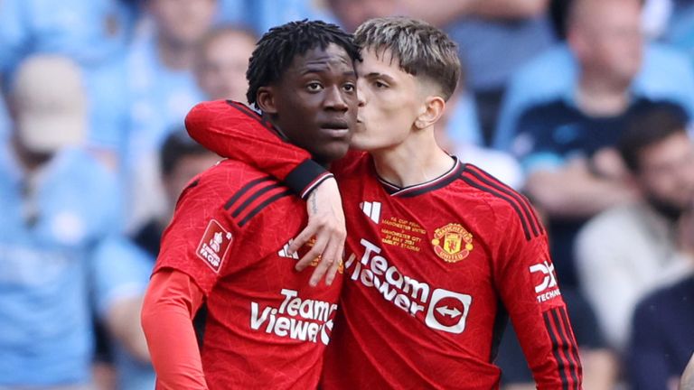 Goal scorers Kobbie Mainoo and Alejandro Garnacho celebrate after Manchester United took a 2-0 lead against Manchester City