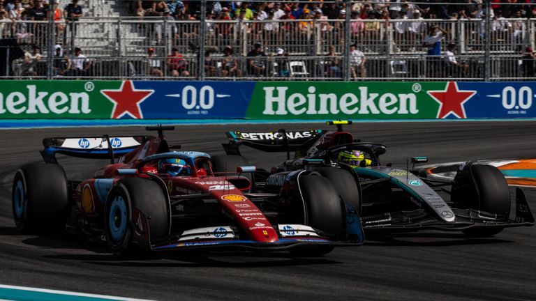 MIAMI INTERNATIONAL AUTODROME, UNITED STATES OF AMERICA - MAY 05: Sir Lewis Hamilton, Mercedes F1 W15, battles with Charles Leclerc, Ferrari SF-24 during the Miami GP at Miami International Autodrome on Sunday May 05, 2024 in Miami, United States of America. (Photo by Alexander Trienitz / LAT Images)