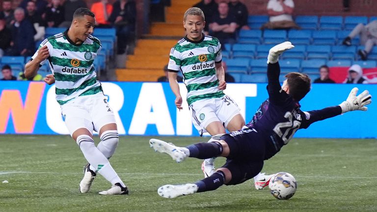Celtic's Adam Idah scores their side's first goal against Kilmarnock