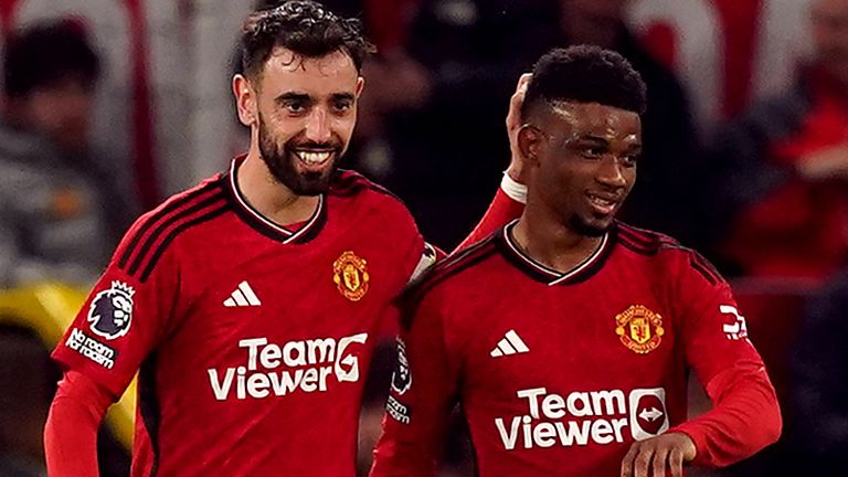 Manchester United's Amad Diallo celebrates scoring their side's second goal with Bruno Fernandes