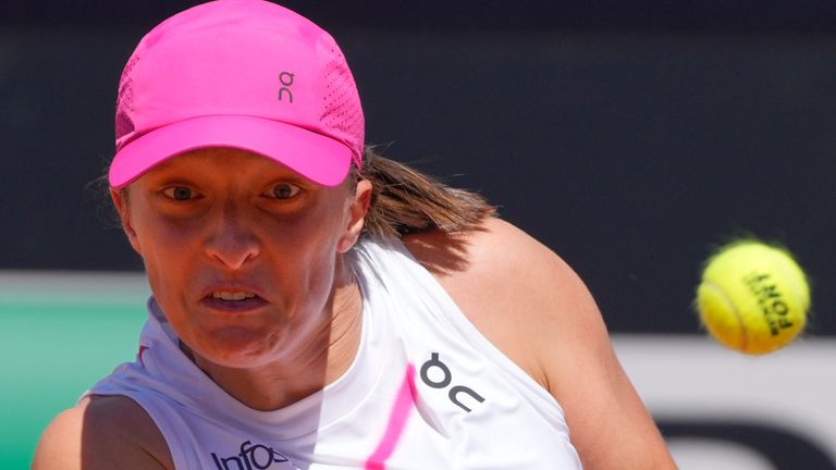 Iga Swiatek, of Poland, returns the ball to YuliaPutintseva, of Kazakhstan, during their match at the Italian Open tennis tournament in Rome, Saturday, May 11, 2024.(AP Photo/Gregorio Borgia)