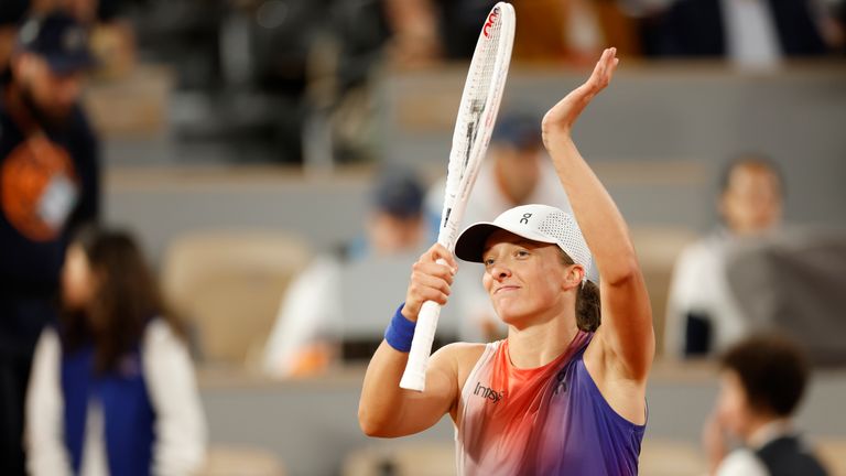 Poland's Iga Swiatek celebrates as she won her first round match against France's Leolia Jeanjean at the French Open tennis tournament, at the Roland Garros stadium in Paris, Monday, May 27, 2024. (AP Photo/Jean-Francois Badias)