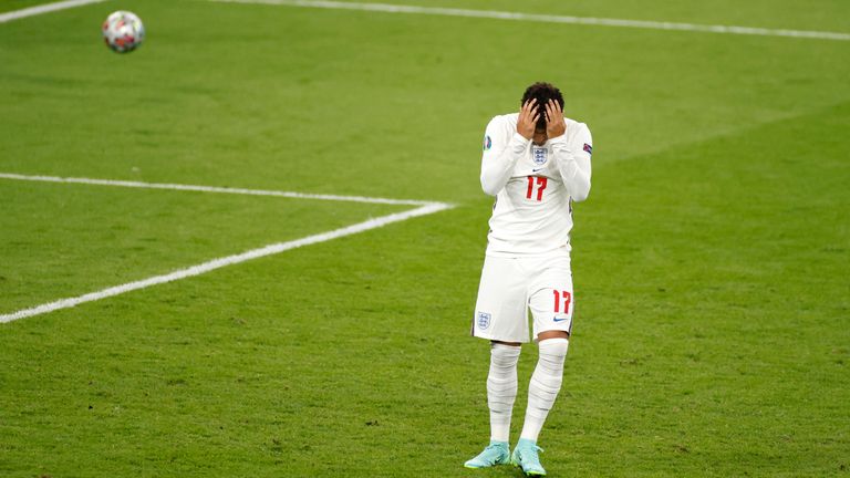 England's Jadon Sancho reacts after missing a shot on goal during the penalty shootout in the Euro 2020 soccer championship final between England and Italy at Wembley stadium in London, Sunday, July 11, 2021.