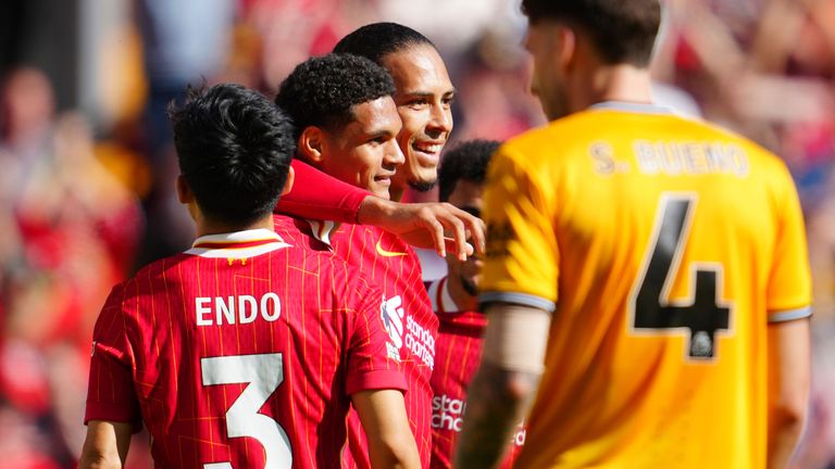 Jarell Quansah celebrates with Virgil van Dijk after doubling Liverpool's lead