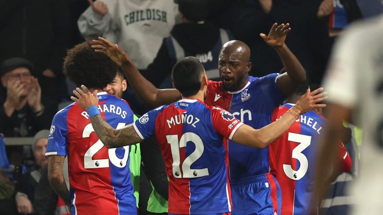 Crystal Palace's Jean-Philippe Mateta, right, celebrates with teammates after scoring his side's second goal during the English Premier League soccer match between Crystal Palace and Manchester United at Selhurst Park stadium in London, England, Monday, May 6, 2024. (AP Photo/Ian Walton)
