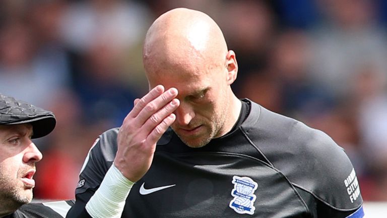BIRMINGHAM, ENGLAND - MAY 04: John Ruddy of Birmingham City looks dejected as he is escorted off the pitch as fans invade, after Birmingham City are relegated to League One, during the Sky Bet Championship match between Birmingham City and Norwich City at St Andrews (stadium) on May 04, 2024 in Birmingham, England. (Photo by Cameron Smith/Getty Images)