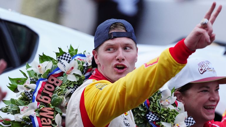 INDIANAPOLIS, IN - MAY 26: IndyCar driver Josef Newgarden holds up 2 fingers for his second consecutive Indy 500 win after winning the 108th running of the Indianapolis 500 on May 26, 2024, at the Indianapolis Motor Speedway in Indianapolis, Indiana. (Photo by Brian Spurlock/Icon Sportswire) (Icon Sportswire via AP Images)