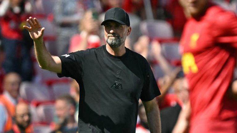 Jurgen Klopp waves to fans as he checks out the conditions ahead of the Premier League match between Liverpool and Wolves