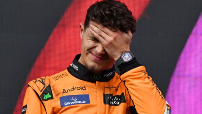 AUTODROMO INTERNAZIONALE ENZO E DINO FERRARI, ITALY - MAY 19: Lando Norris, McLaren F1 Team, 2nd position, stands on the podium during the podium ceremony during the Emilia Romagna GP at Autodromo Internazionale Enzo e Dino Ferrari on Sunday May 19, 2024 in imola, Italy. (Photo by Mark Sutton / Sutton Images)