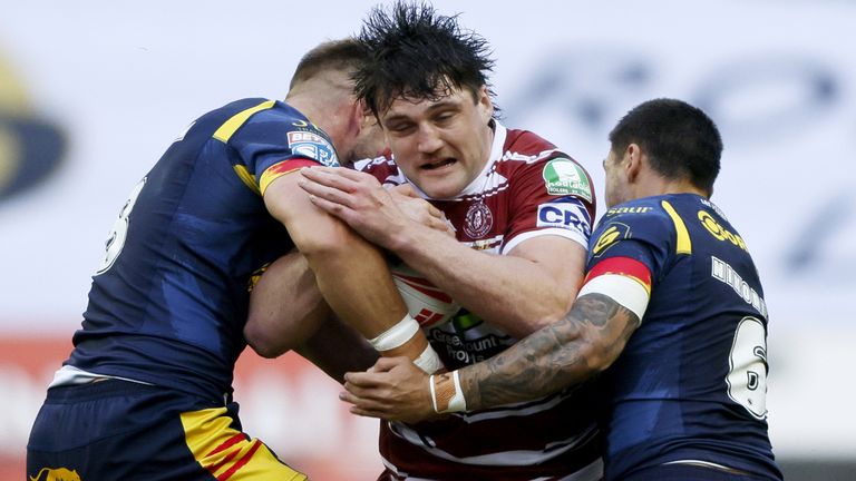 Wigan Warriors v Catalans Dragons - Betfred Super League - DW Stadium
Wigan Warriors' Liam Byrne (centre) is tackled during the Betfred Super League match at the DW Stadium, Wigan. Picture date: Thursday May 2, 2024.