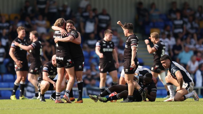 The London Broncos players hug at the final whistle