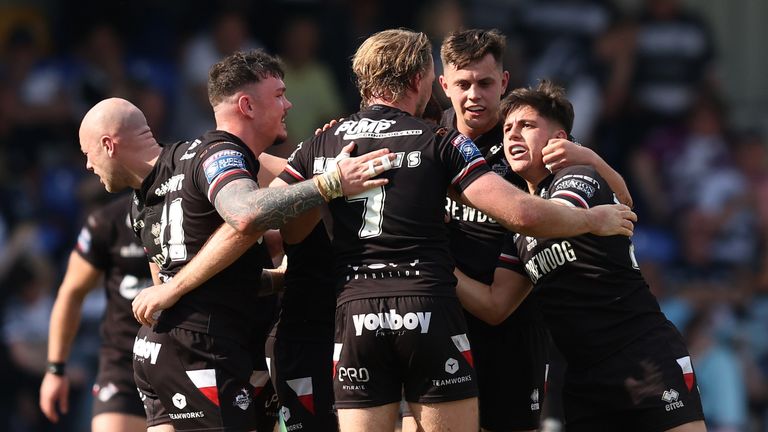 London Broncos players celebrate their first win of the season after defeating Hull FC
