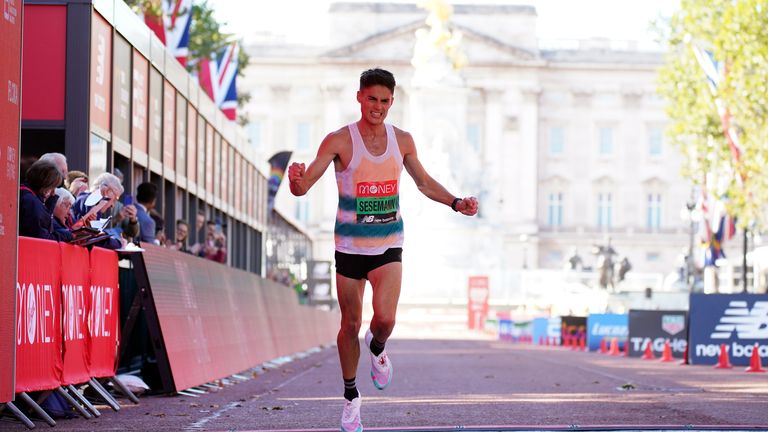 Phil Sesemann crosses the line to finish 7th in the Men's elite race during the Virgin Money London Marathon.