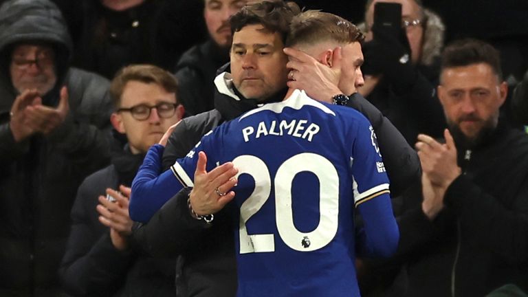 Chelsea's head coach Mauricio Pochettino hugs Chelsea's Cole Palmer