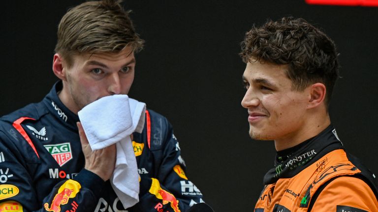 Winner Red Bull Racing's Dutch driver Max Verstappen (L) and second-placed McLaren's British driver Lando Norris react after the Formula One Chinese Grand Prix at the Shanghai International Circuit in Shanghai on April 21, 2024. (Photo by PEDRO PARDO / AFP)