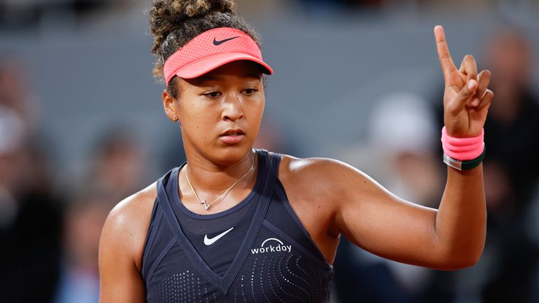 Japan's Naomi Osaka gestures during her second round match of the French Open tennis tournament against Poland's Iga Swiatek at the Roland Garros stadium in Paris, Wednesday, May 29, 2024. (AP Photo/Jean-Francois Badias)