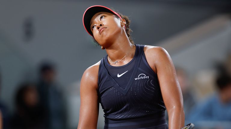 Japan's Naomi Osaka reacts after missing a shot against Poland's Iga Swiatek during their second round match of the French Open tennis tournament at the Roland Garros stadium in Paris, Wednesday, May 29, 2024. (AP Photo/Jean-Francois Badias)