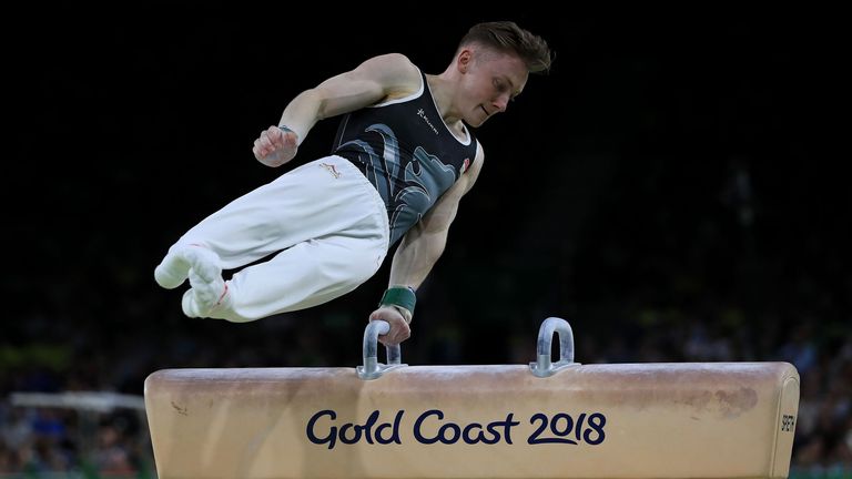 England's Nile Wilson on the Pommel Horse on his way to winning a gold medal in the Men's Individual All-Round Final with coach Ben Collie at the Coomera Indoor Sports Centre during day three of the 2018 Commonwealth Games in the Gold Coast, Australia. 