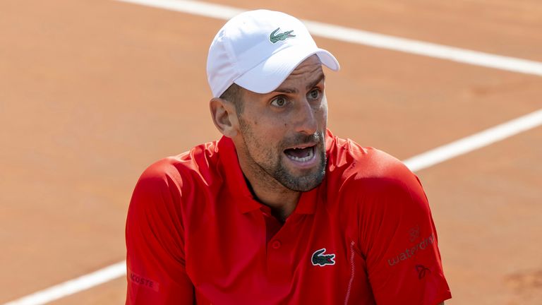 Novak Djokovic, of Serbia, reacts after losing a point as he plays Tomas Machac, of the Czech Republic, during their semi-final match, at the ATP 250 Geneva Open tennis tournament in Geneva, Switzerland, Friday, May 24, 2024. (Martial Trezzini/Keystone via AP)