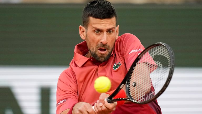 Serbia's Novak Djokovic plays a shot against France's Pierre-Hugues Herbert during their first round match of the French Open tennis tournament at the Roland Garros stadium in Paris, Tuesday, May 28, 2024. (AP Photo/Christophe Ena)
