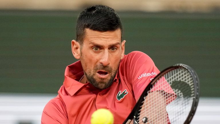 Serbia's Novak Djokovic plays a shot against France's Pierre-Hugues Herbert during their first round match of the French Open tennis tournament at the Roland Garros stadium in Paris, Tuesday, May 28, 2024. (AP Photo/Christophe Ena)