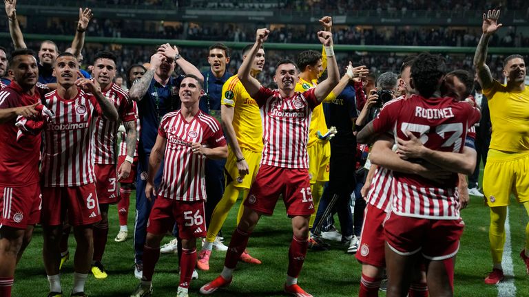 Olympiacos players celebrate their victory