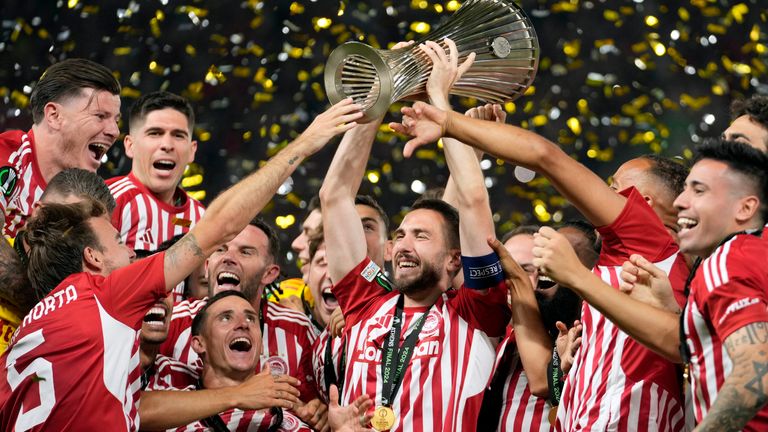 Olympiakos' Kostas Fortounis lifts the trophy