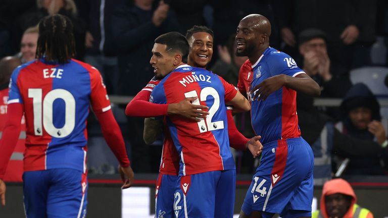 Crystal Palace's Michael Olise, centre, celebrates with teammates after scoring his side's opening goal during the English Premier League soccer match between Crystal Palace and Manchester United at Selhurst Park stadium in London, England, Monday, May 6, 2024. (AP Photo/Ian Walton)