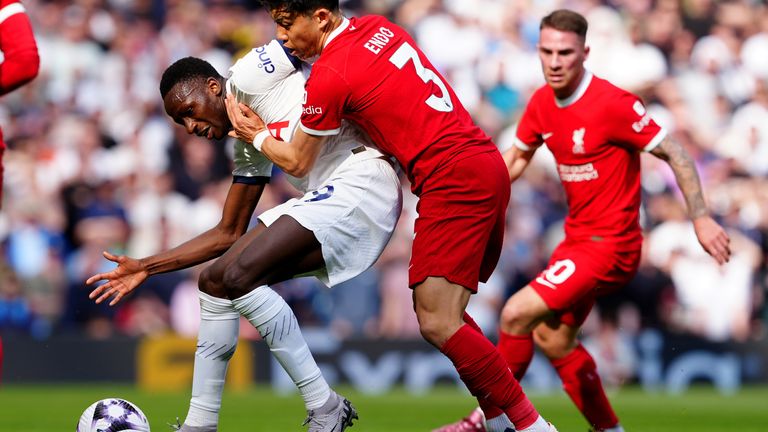 Pape Matar Sarr and Wataru Endo in Premier League action at Anfield