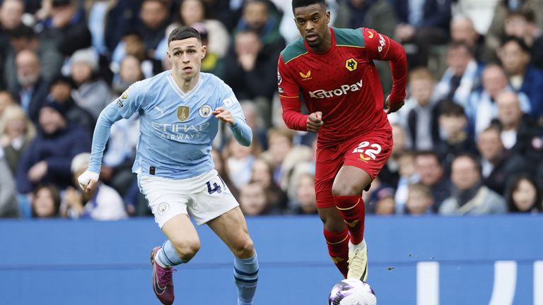 Manchester City's Phil Foden and Wolves' Nelson Semedo in action
