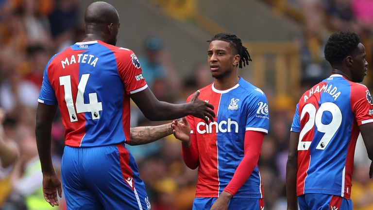 Michael Olise celebrates scoring Crystal Palace's first goal with team-mate Jean-Philippe Mateta