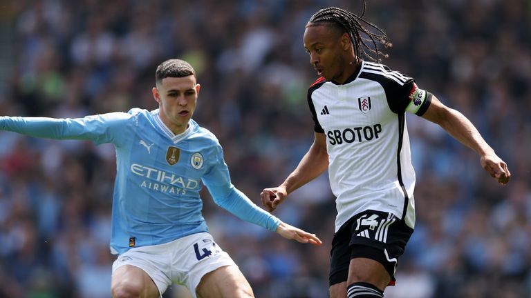 Bobby Decordova-Reid is challenged by Phil Foden 