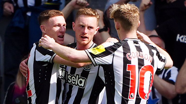 Sean Longstaff is congratulated after equalising for Newcastle against Brighton