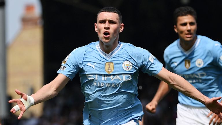 Phil Foden wheels away to celebrate after scoring Man City's second goal at Fulham