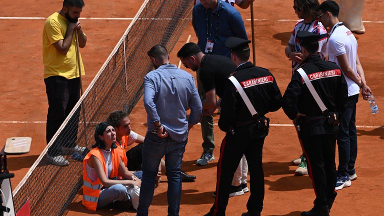 Protesters block the court during the Men's Doubles Round of 16 match between Marcelo Arevalo and Mate Pavic, and Santiago Gonzalez and Edouard Roger-Vasselin